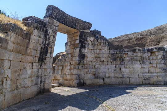 Interior of the Treasury of Minyas tholos tomb with its massive stone doorway and curved ashlar walls, Orchomenos, Greece