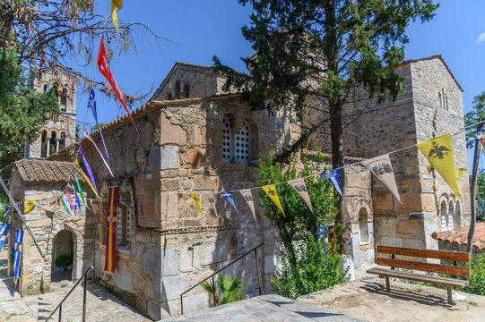 Ninth century Byzantine church of Panagia Skripou dressed with colorful festival pennants, Orchomenos, Boeotia, Greece