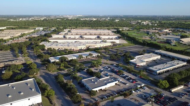 Local roadway divides flex office space from distribution centers in Alamo Downs Business Park along Loop 410 corridor. Vehicle parking bays surround mid rise commercial facilities, San Antonio