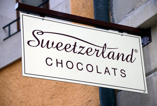 Geneva, Switzerland, Europe : Swiss-made artisanal chocolate, Sweetzerland Chocolats manufacturer from Geneva, finest ingredients, sign above entrance to boutique, Rue du Mont-Blanc 