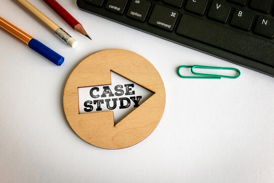 CASE STUDY Concept on Wooden Arrow Beside Creative Office Supplies