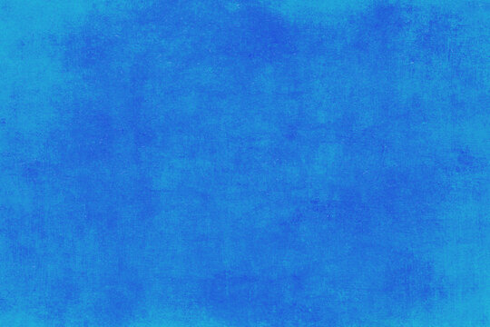 Abstract blue watercolor background. The color splashing on the paper. Hand drawn.