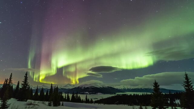 Vibrant Aurora Borealis Dancing Over a Snowy Mountain Landscape at Night.