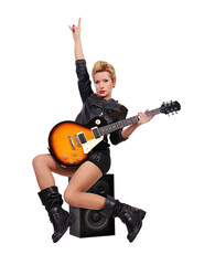Fototapeta premium Woman playing electric guitar while sitting on speaker.