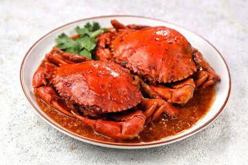 Chili Crab is one of the most popular seafood dishes and is a culinary icon of Singapore. © Noor