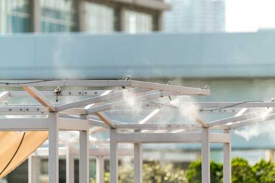 Sprinklers, cooling water mist, water cooling in the restaurant garden