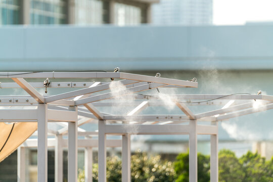 Sprinklers, cooling water mist, water cooling in the restaurant garden