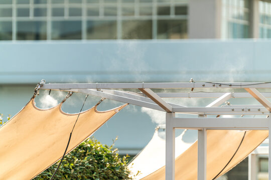 Sprinklers, cooling water mist, water cooling in the restaurant garden