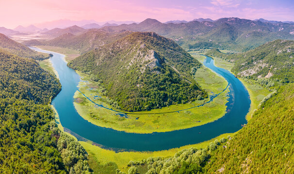 Skadar Lake National Park, Montenegro. Crnojevica river creating famous horseshoe bend and loop surrounded by lush green hills