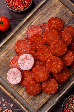 Slices of smoked pepperoni or salami for making homemade pizza. Sliced pepperoni