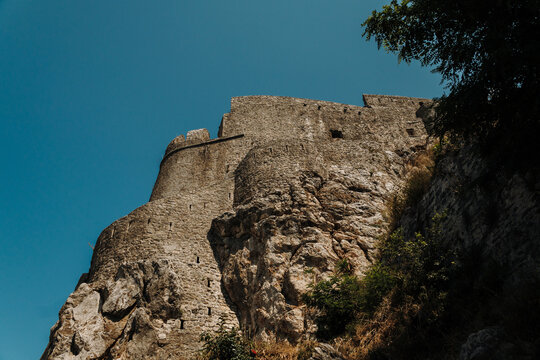 Historic Kanli Kula Fortress rising above rocky cliffs in Herceg Novi, Montenegro. Medieval stone fortification overlooking the Adriatic coast