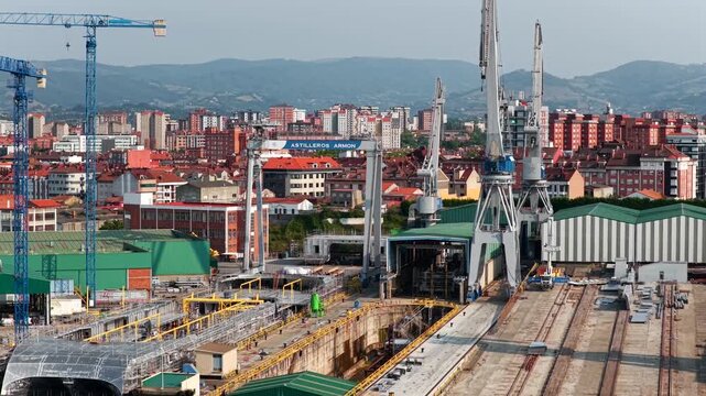 Aerial View of Shipyards, Boat Building Docks, Cranes, and Dry Docks in the Port of El Musel in Gijon, Asturias, Northern Spain
