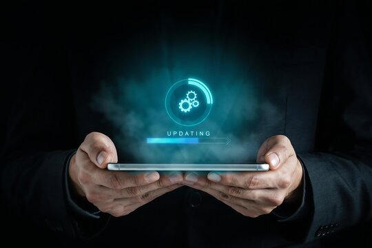 Man holds phone displaying updating progress bar and gears, indicating software or system update completion.