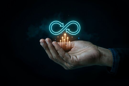 Hand holds an infinity symbol with upward arrows symbolizing continuous growth and progress.