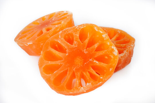 Candied bael fruit on white background