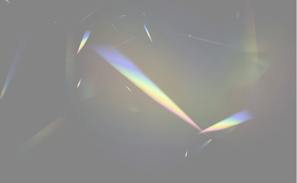 Dark background illuminated by scattered prism-like refracted light beams in rainbow colors on transparent background