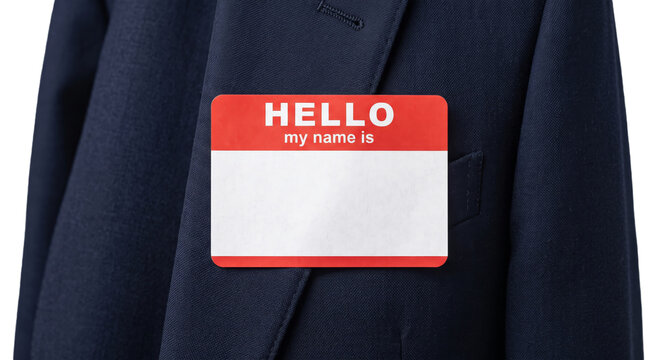 Hello my name is sticker on a dark blue suit jacket lapel