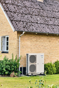Panasonic heat pump for energy efficient house heating in Viborg Denmark sustainable home climate control system This modern outdoor appliance reduces