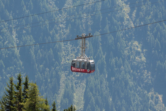Brevent Cable Car Gondola Suspended Above Dense Forested Slopes in Chamonix, French Alps