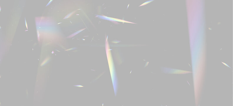 Fragmented rainbow light beams scattered randomly on a black background with soft glow and prism effects on transparent background