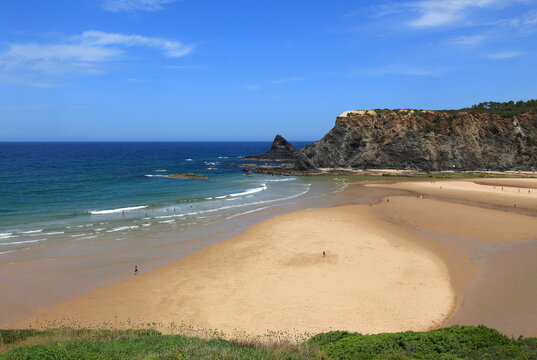 Portugal, Odeceixe. South-West Alentejo and Vicentine Coast Natural Park. Panoramic view of the rugged cliffs and clear Atlantic Ocean washing onto Odeceixe beach. A growing tourist destination.