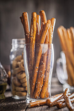 Salted Pretzel Sticks in Glass Jar Rustic Snack Table Setting for Party and Appetizers