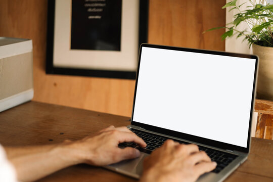 computer screen blank mockup.work using laptop with white background for advertising,contact business search information on desk at coffee shop.marketing and creative design
