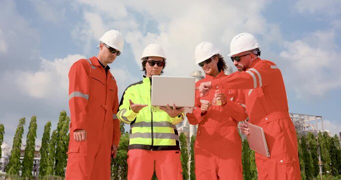 Multiracial safety officer holds laptop for refinery crew reviewing liquid sample, supporting petrochemical compliance audit, pipeline risk assessment, maintenance planning workflow report review