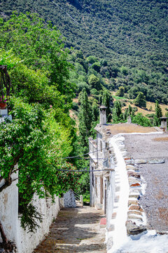 Typical street of an Andalusian village Bubion.