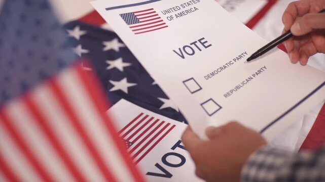 A U.S. citizen holding a ballot at a polling station during the U.S. Congressional midterm elections