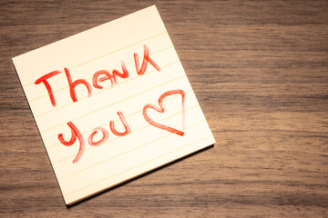 A handwritten note with the text Thank You  on it. © Sonny