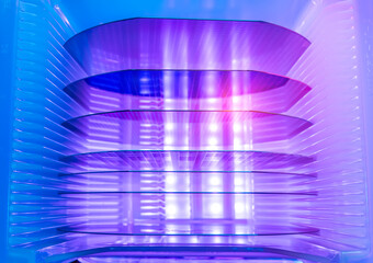 Silicon Wafers in white plastic holder box used in electronics for the fabrication of integrated circuits.AI Hardware and Semiconductor Industry Concept.