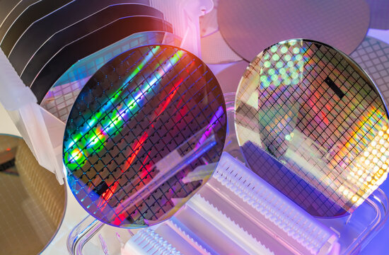 Silicon Wafers in white plastic holder box used in electronics for the fabrication of integrated circuits.AI Hardware and Semiconductor Industry Concept.