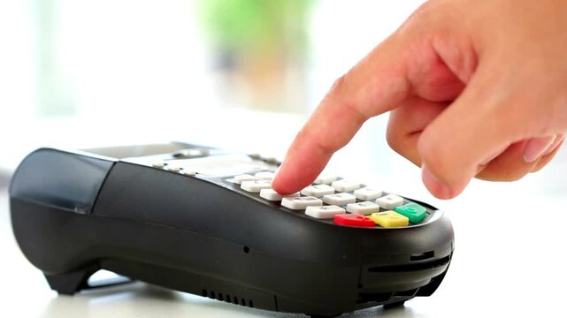 Credit card payment on modern terminal for retail store purchase to buy and sell shopping products and consumer goods in 4K Ultra HD footage
