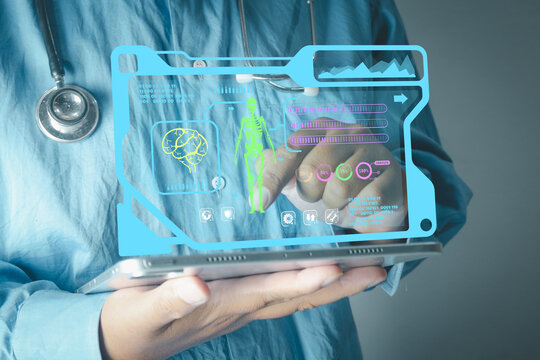 Futuristic healthcare and medical technology concept. Doctor using a tablet with a holographic HUD interface displaying brain, skeleton anatomy, and patient data analysis graphics.
