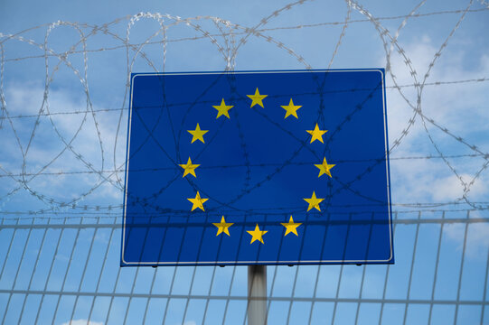 Ceuta border crossing, illegal immegration and migration to EU, barbed wire, refugee invasion, fence coils of razor wires, protection and security concept