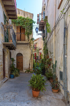 Charming narrow street with traditional houses in Monreale, Sicily