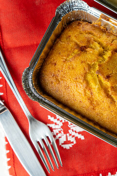 Close Up of Baked Sopa Paraguaya Cornbread with Fork and Knife