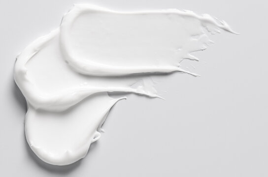 The white texture of cosmetic body cream.