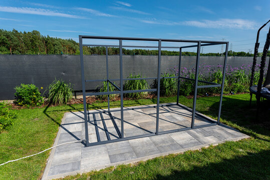 Metal frame structure for garden woodshed construction