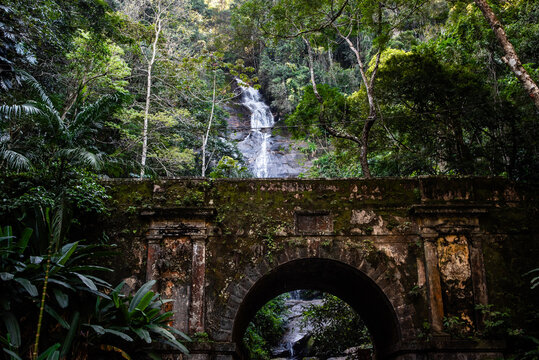 bridge and waterfall in the background