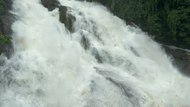 Athirappilly Waterfalls Niagara of India  Kerala largest waterfall. Flooding river in lush rainforests of the Western Ghats. Tropical  Athirapally Vazhachal  Charpa Falls, Indian