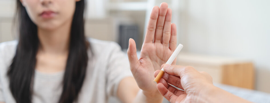 addiction asian young woman, girl refusing cigarette, smoker quitting smoke, hand in broken, break tobacco. Quit bad habit, health care concept. Willpower lifestyle of people