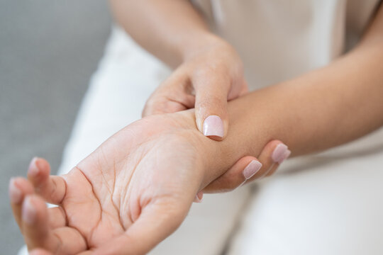 Close-up shot of human hands suffering from ligament inflammation on the palm.