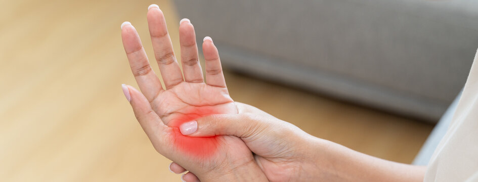 Close-up shot of human hands suffering from ligament inflammation on the palm.