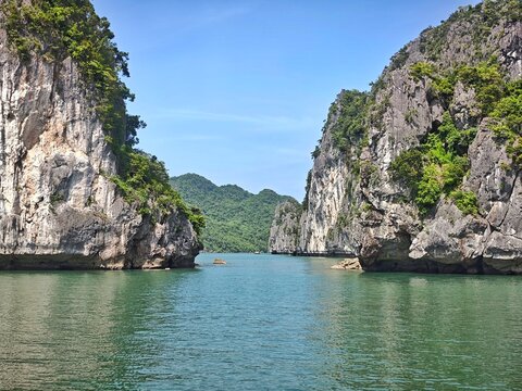 Lan Ha Bay, Haiphong City, Vietnam. The bay is recognized by UNESCO as a natural world heritage site, with limestone mountains formed millions of years ago, and vegetation, surrounding a bay in a trop