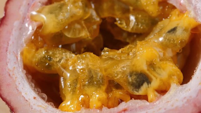 Water Droplets Falling on Ripe Passion Fruit in Slow Motion
