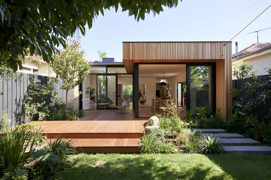 The remodeling of a contemporary home expansion in Melbourne encompasses the inclusion of a deck, patio, and courtyard section.