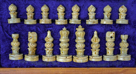 Fototapeta premium Chess Pieces in Storage Case on Deep Blue Velvet. Strategy, Preparation, and Leadership Concept.