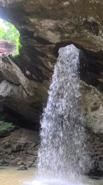 water flowing over rocks in forest./Discover the magic of Sang Chan Waterfall in Ubon Ratchathani&mdash;Thailand's famous 'Hole Waterfall' Amazing Thailand. 